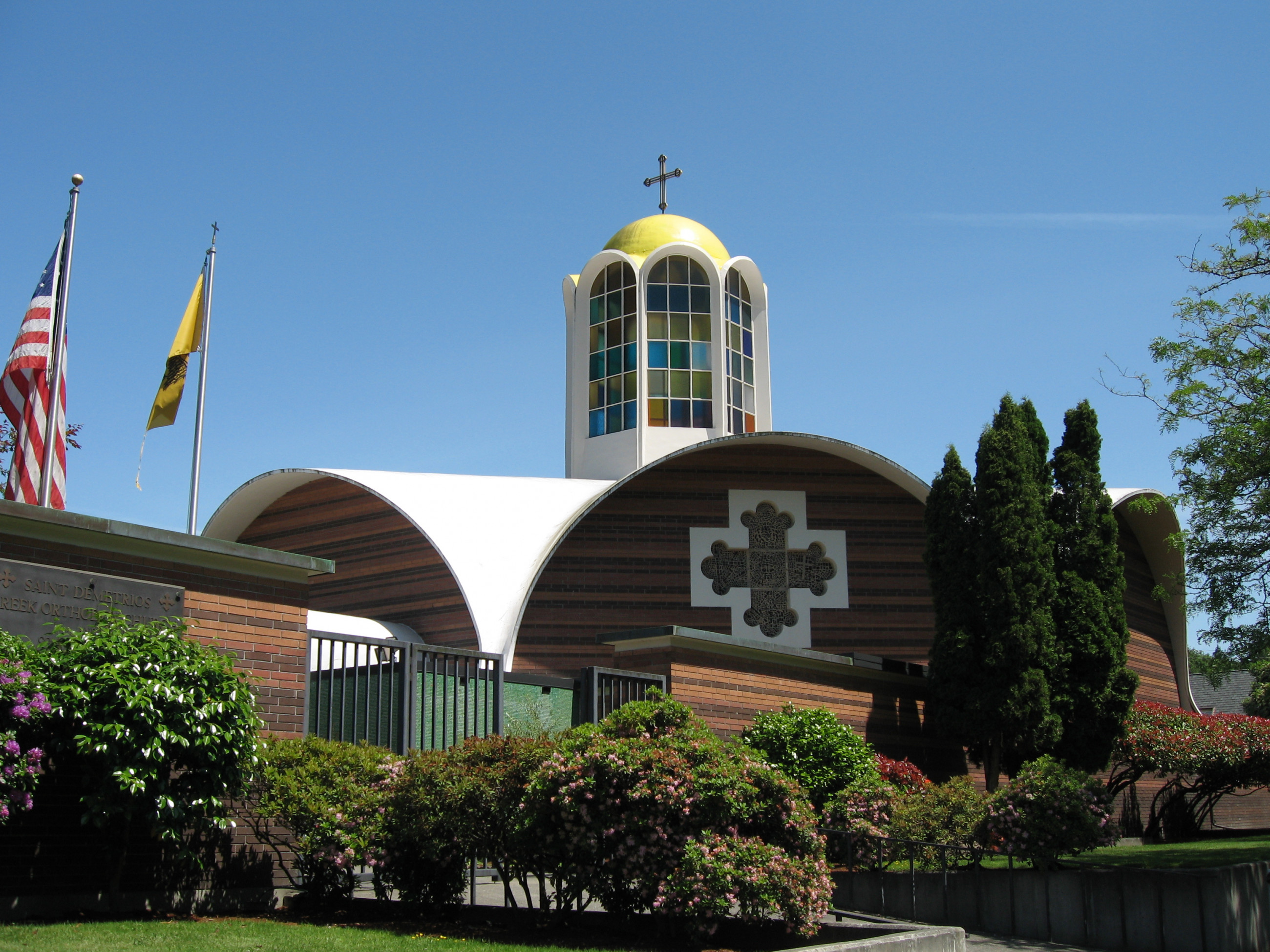 St. Demetrios Greek Orthodox Church exterior, with its gold dome and cross